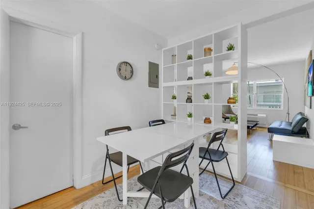 a view of a livingroom with furniture and wooden floor