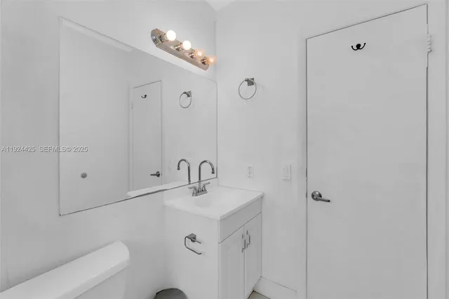 a bathroom with a sink and mirror