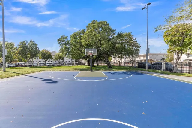 a view of a swimming pool with an outdoor space and seating area