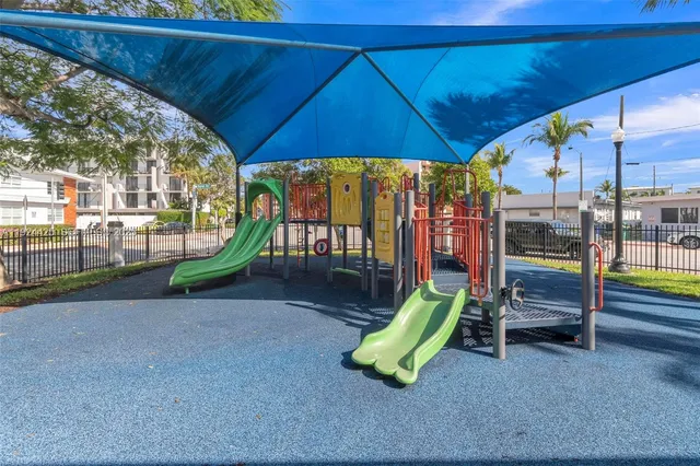 a view of a park with a slide
