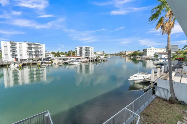 a view of a lake with a table and chairs