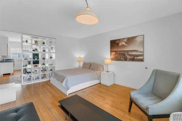 a bedroom with a bed and furniture