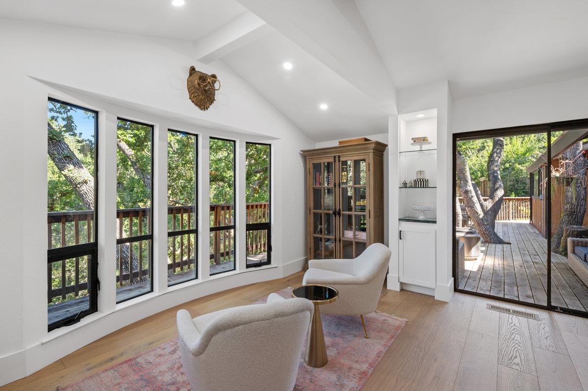 27 Oakwood Road Orinda, CA 94563 - Photo 14 of 61 a living room with furniture and large windows
