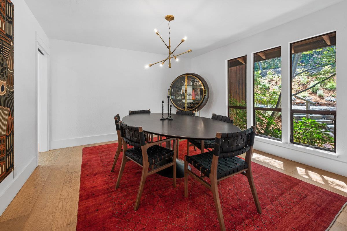 27 Oakwood Road Orinda, CA 94563 - Photo 15 of 61 a view of a dining room with furniture window and wooden floor