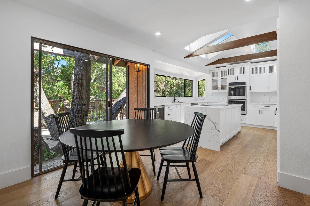 27 Oakwood Road Orinda, CA 94563 - Photo 19 of 61 a dining room with furniture window and wooden floor