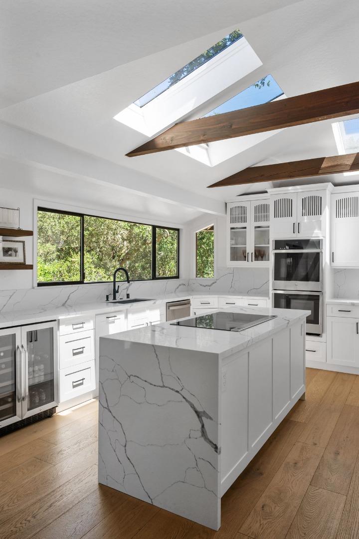 27 Oakwood Road Orinda, CA 94563 - Photo 21 of 61 a kitchen with kitchen island granite countertop a stove and a sink