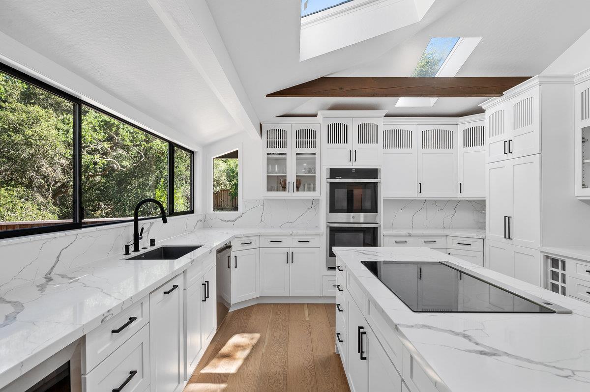 27 Oakwood Road Orinda, CA 94563 - Photo 22 of 61 a kitchen with a sink stove top oven and cabinets