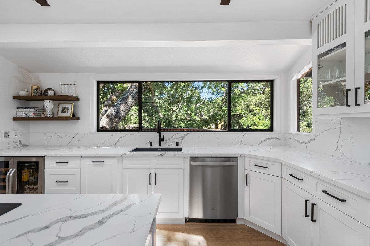 27 Oakwood Road Orinda, CA 94563 - Photo 24 of 61 a kitchen with a sink white cabinets and a large window