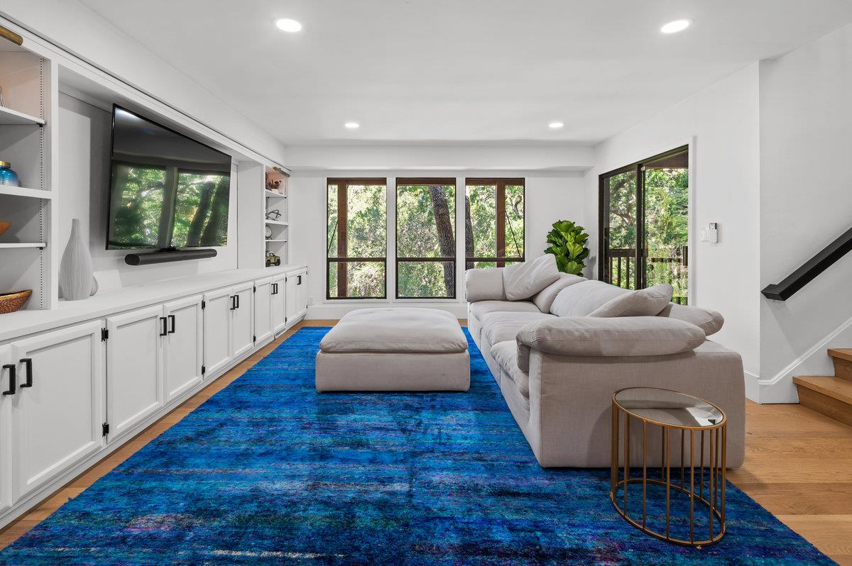 27 Oakwood Road Orinda, CA 94563 - Photo 37 of 61 a living room with furniture and a flat screen tv