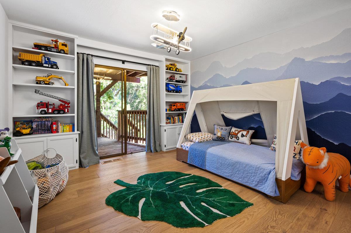 27 Oakwood Road Orinda, CA 94563 - Photo 40 of 61 a bedroom with a bed and a large window