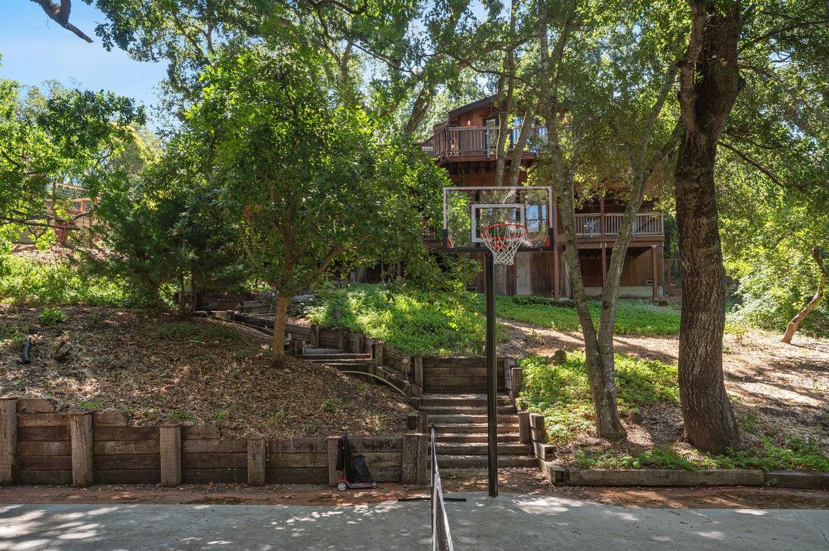27 Oakwood Road Orinda, CA 94563 - Photo 56 of 61 a front view of a house with a tree