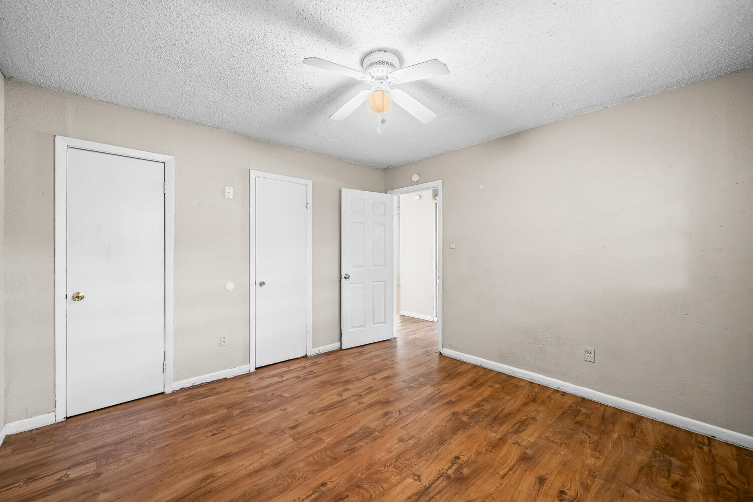 1603 27th Street, Unit B Lubbock, TX 79411 - Photo 12 of 13 wooden floor in an empty room
