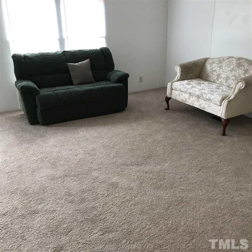 573 George Sherman Road Rougemont, NC 27572 - Photo 3 of 7 a living room with furniture and a couch
