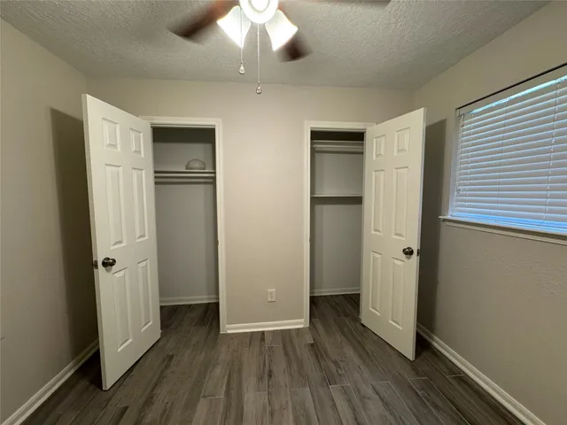 a view of hallway with wooden floor