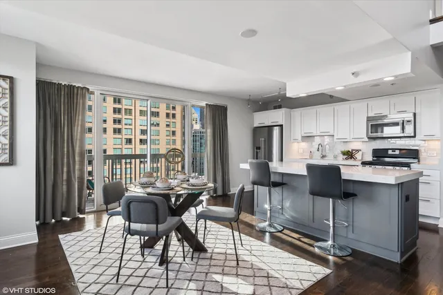 a kitchen that has a cabinets a stove and a refrigerator