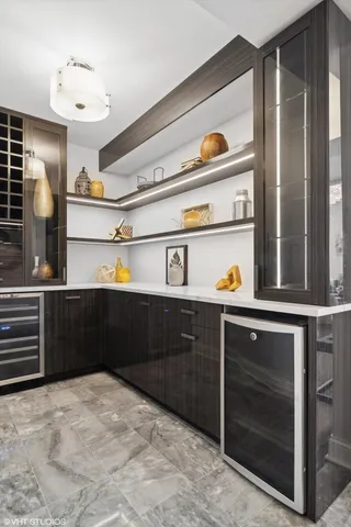 a view of a hallway with furniture and window