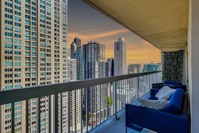 a living room with fireplace furniture and a wooden floor