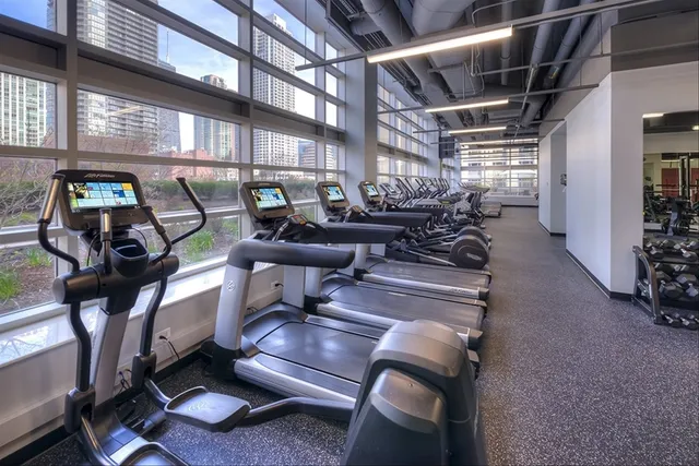 a view of a swimming pool with a table and chairs