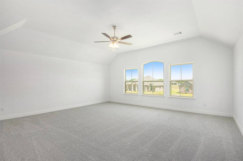 6033 Mango Drive Sanger, TX 76266 - Photo 16 of 29 an empty room with a ceiling fan and window
