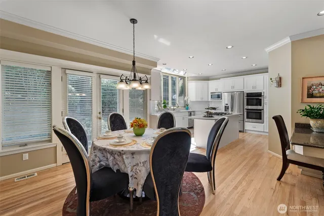 a kitchen with kitchen island a sink and appliances