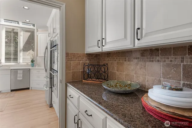 a bedroom with a bed and glass door