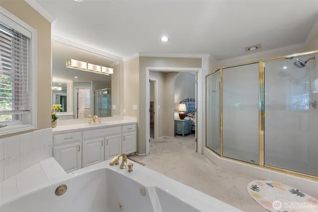 a view of an empty room with cabinet and a window