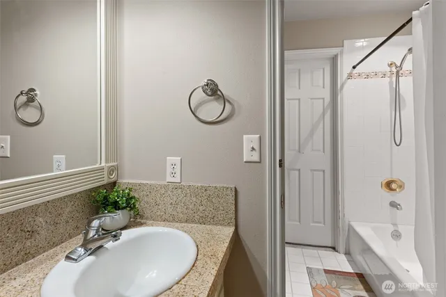 a bedroom with a bed and a view of bathroom