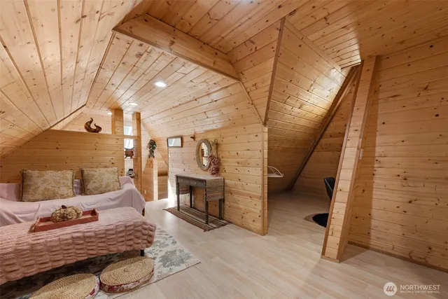 a bedroom with a bed and a table