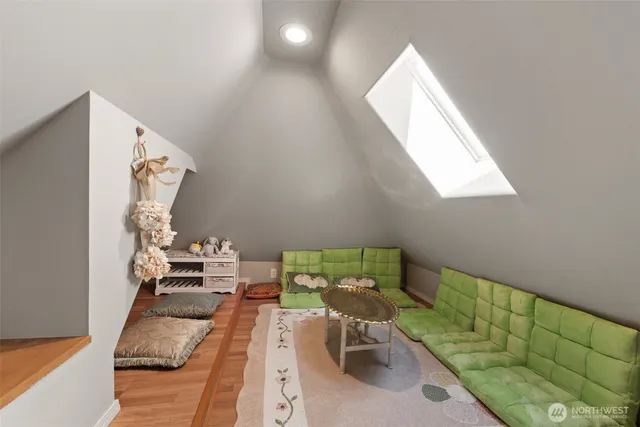a kitchen with granite countertop a refrigerator and cabinets
