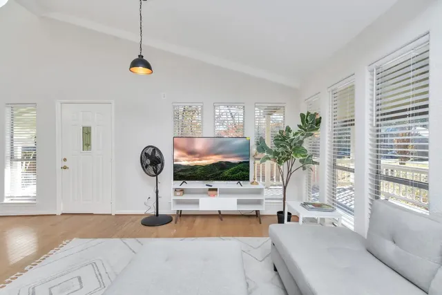a kitchen with granite countertop a sink stainless steel appliances and cabinets