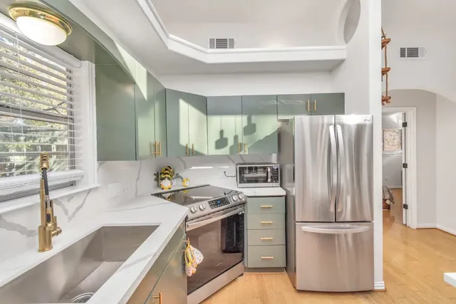 a kitchen with a stove and a sink