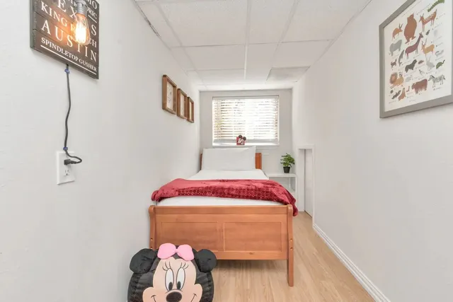 a bedroom with a bed and a view of bathroom