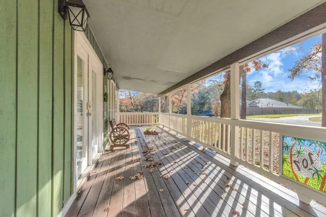 a view of a balcony with chairs