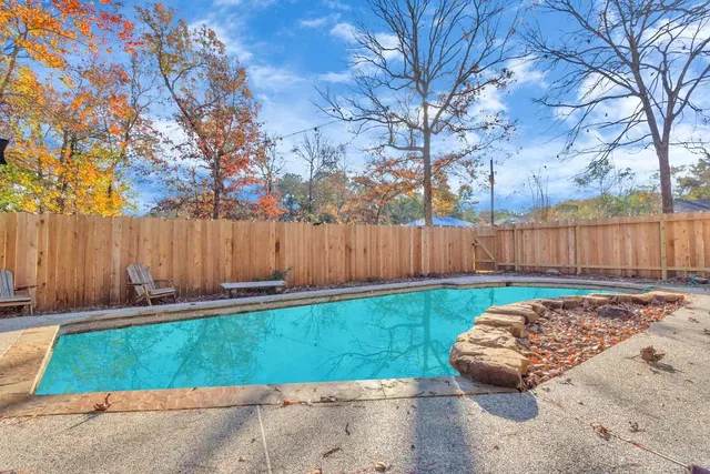 a view of a swimming pool with a sitting area