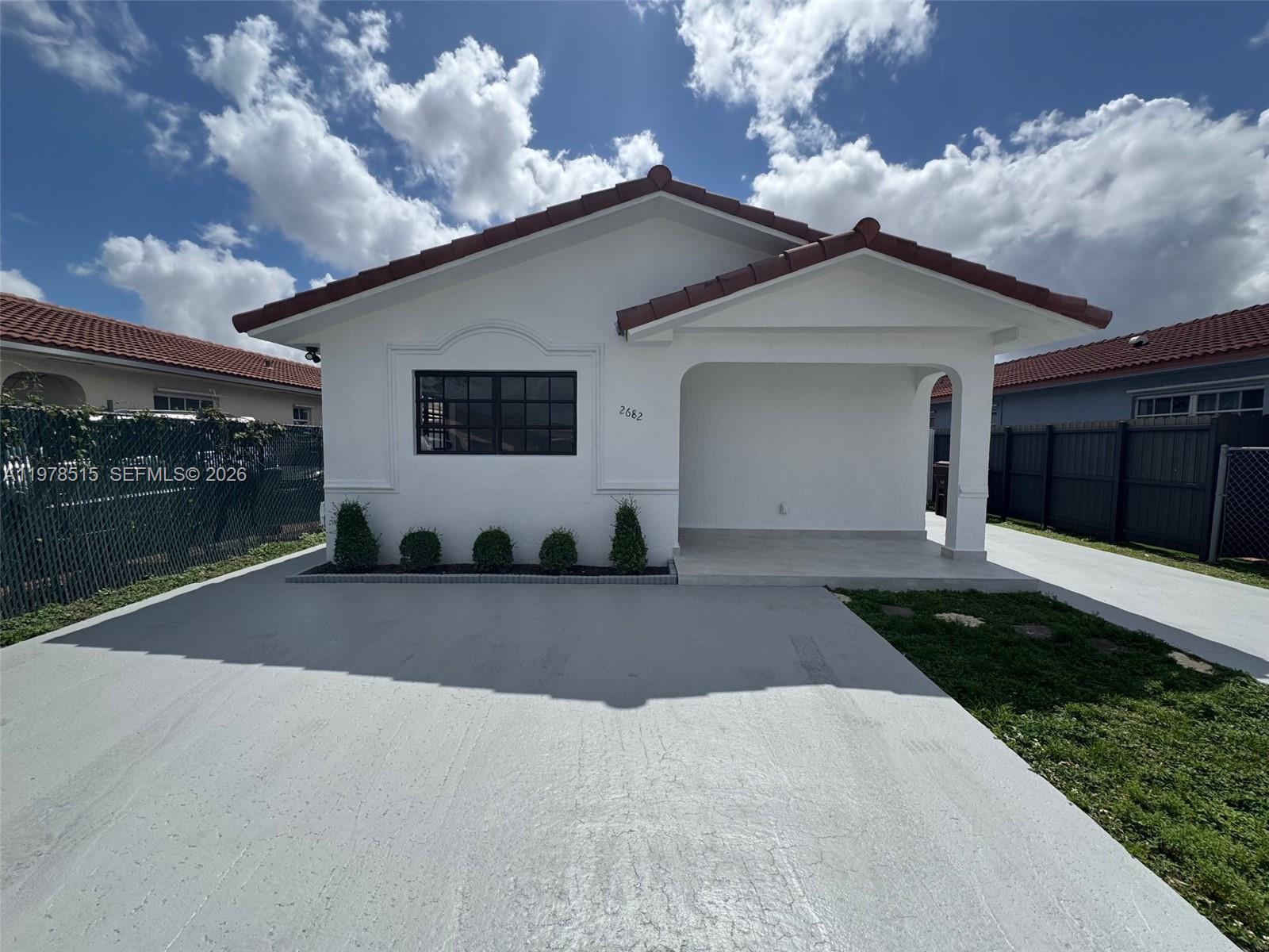 2682 West 70th Place Hialeah, FL 33016 - Photo 1 of 16 a view of a house with a yard