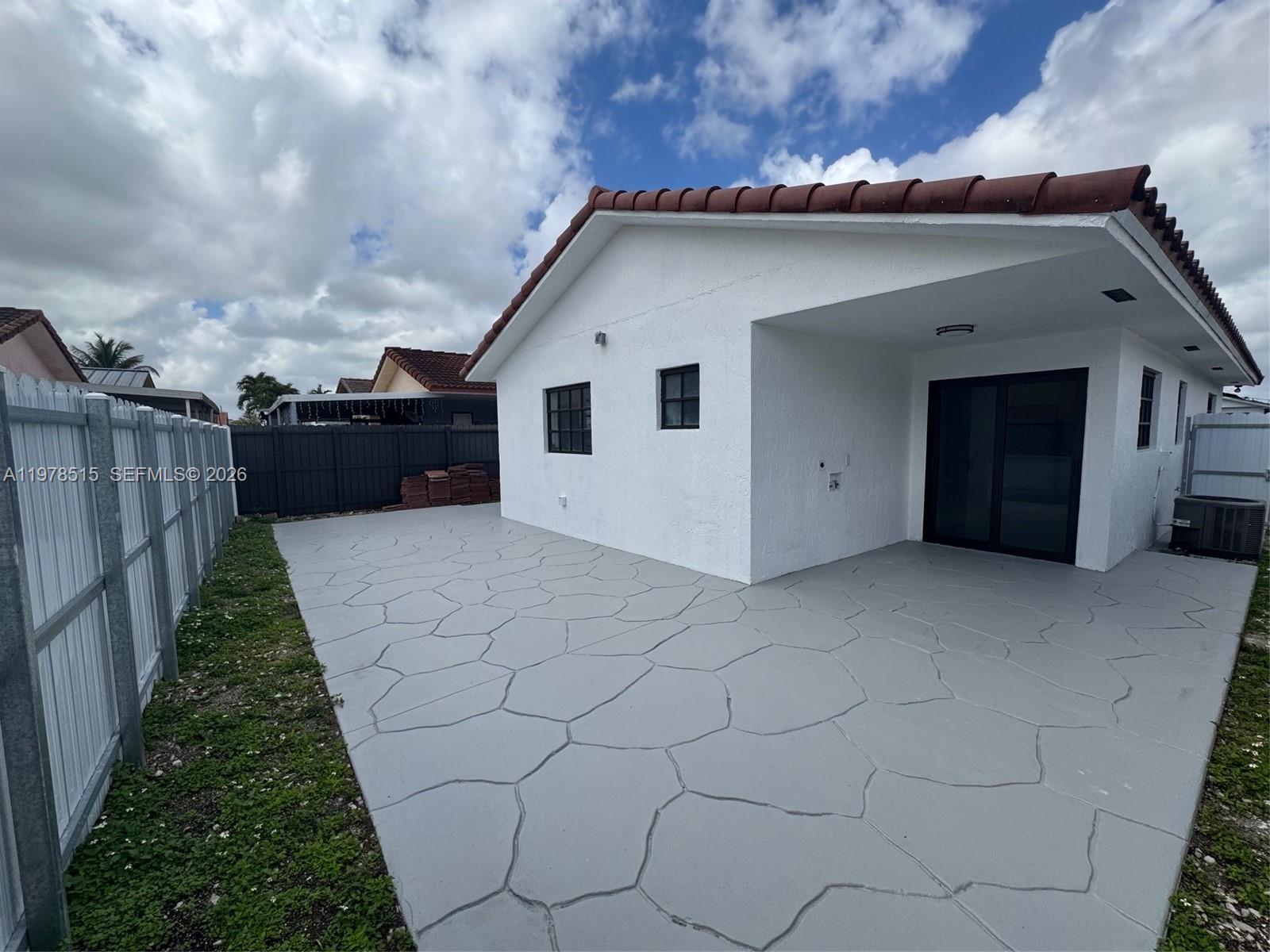 2682 West 70th Place Hialeah, FL 33016 - Photo 15 of 16 a house view with a backyard