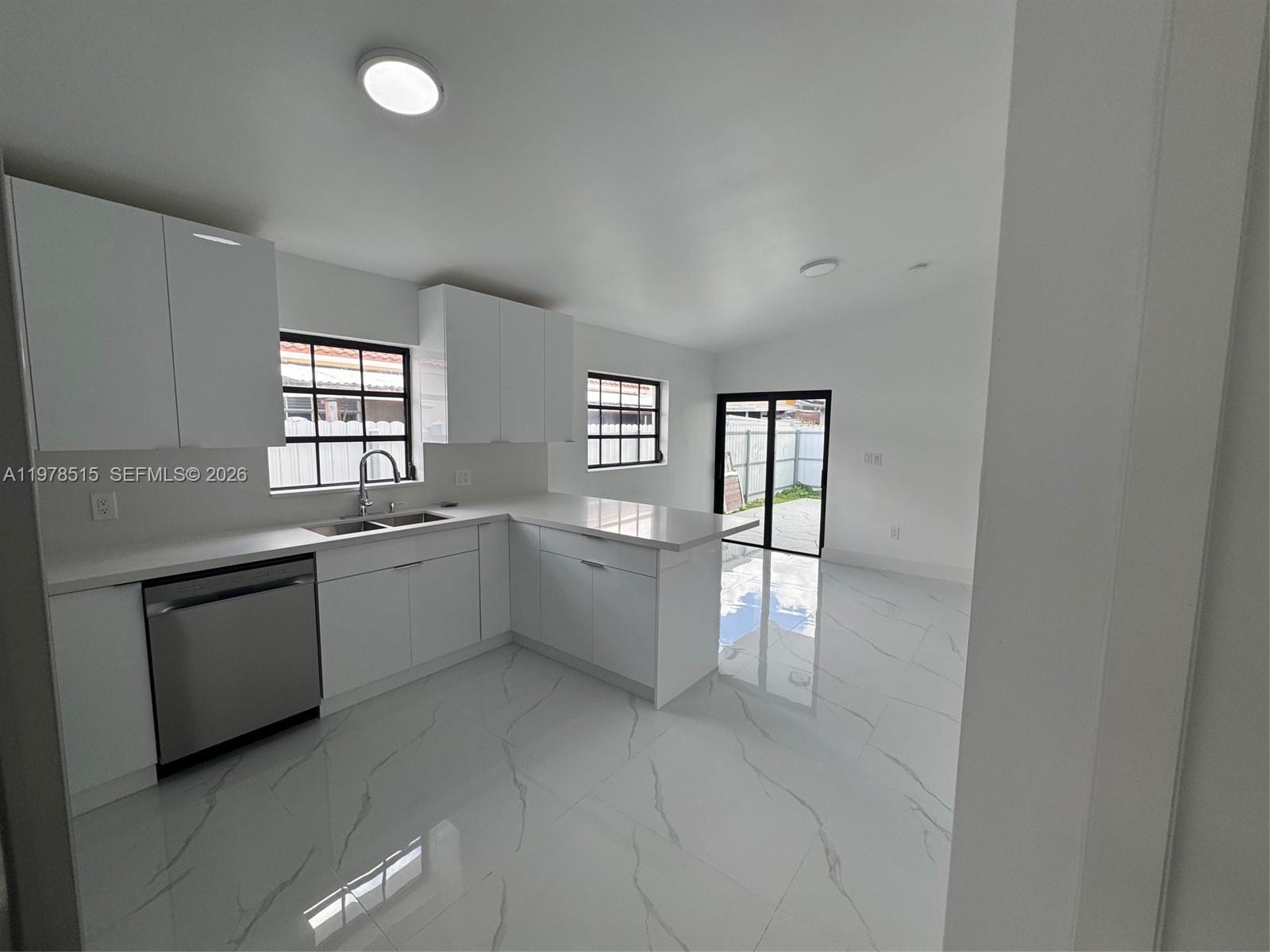 2682 West 70th Place Hialeah, FL 33016 - Photo 5 of 16 a large white room with window