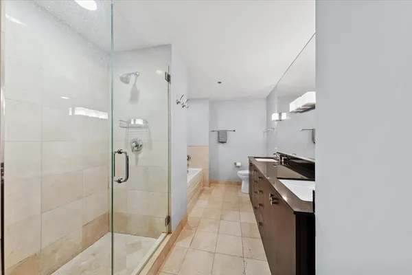 a bathroom with a bathtub and a shower