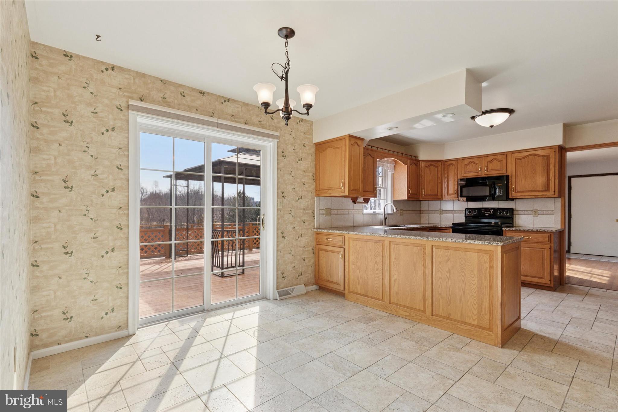 82 Starr Road Reading, PA 19608 - Photo 11 of 56 a kitchen with stainless steel appliances granite countertop a refrigerator and a sink