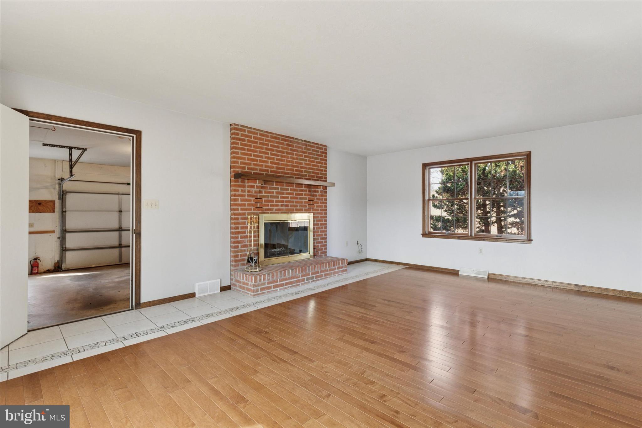 82 Starr Road Reading, PA 19608 - Photo 15 of 56 an empty room with windows and fireplace