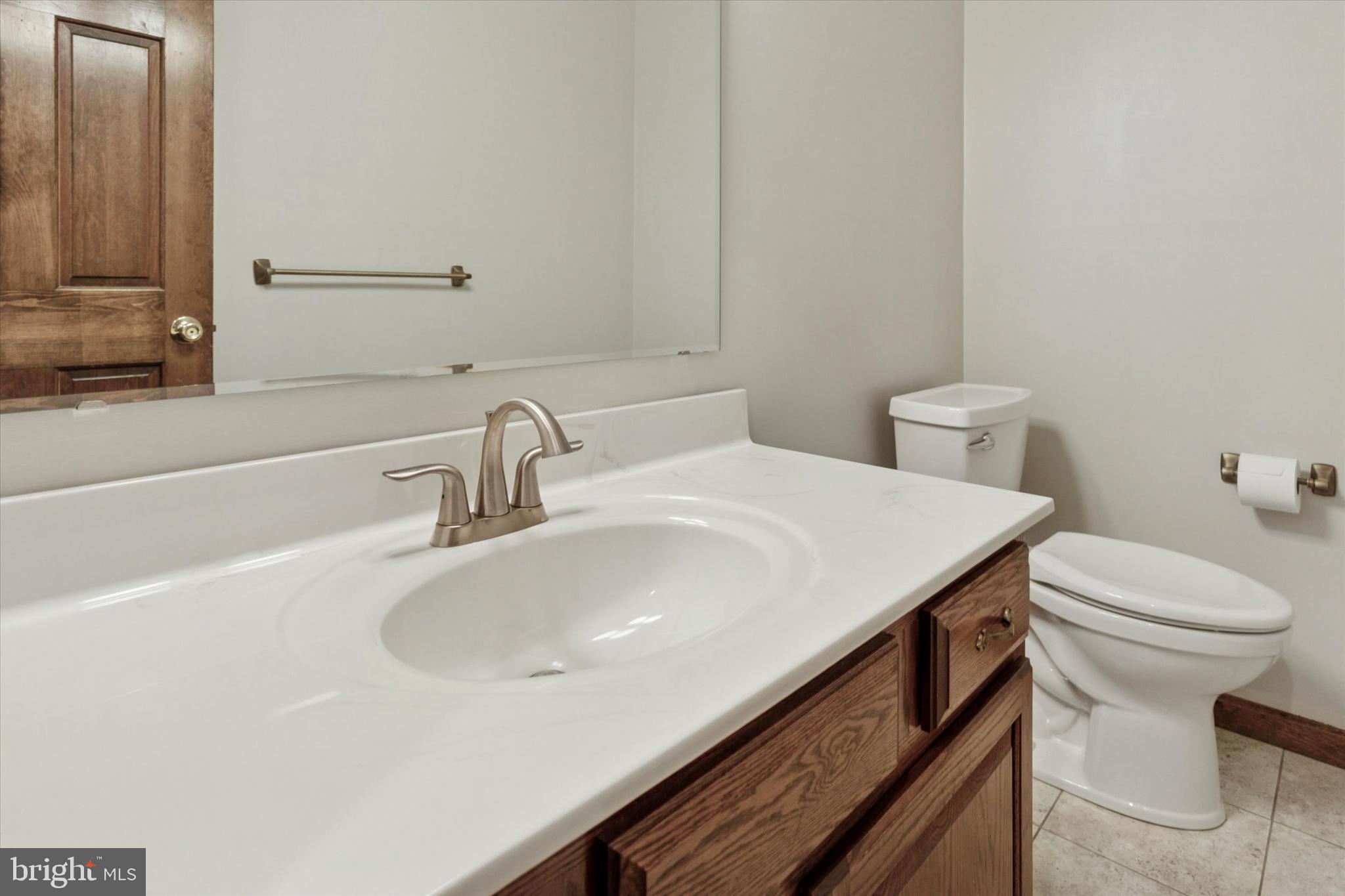 82 Starr Road Reading, PA 19608 - Photo 17 of 56 a bathroom with a sink and a toilet