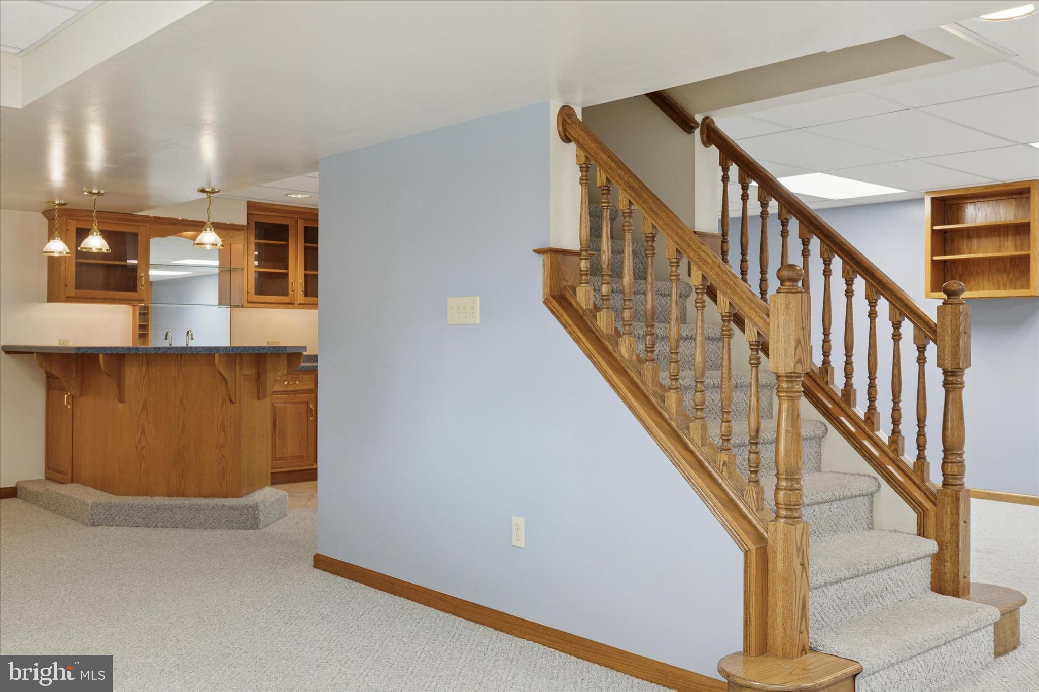 82 Starr Road Reading, PA 19608 - Photo 34 of 56 a view of staircase with lots of frames on wall and windows