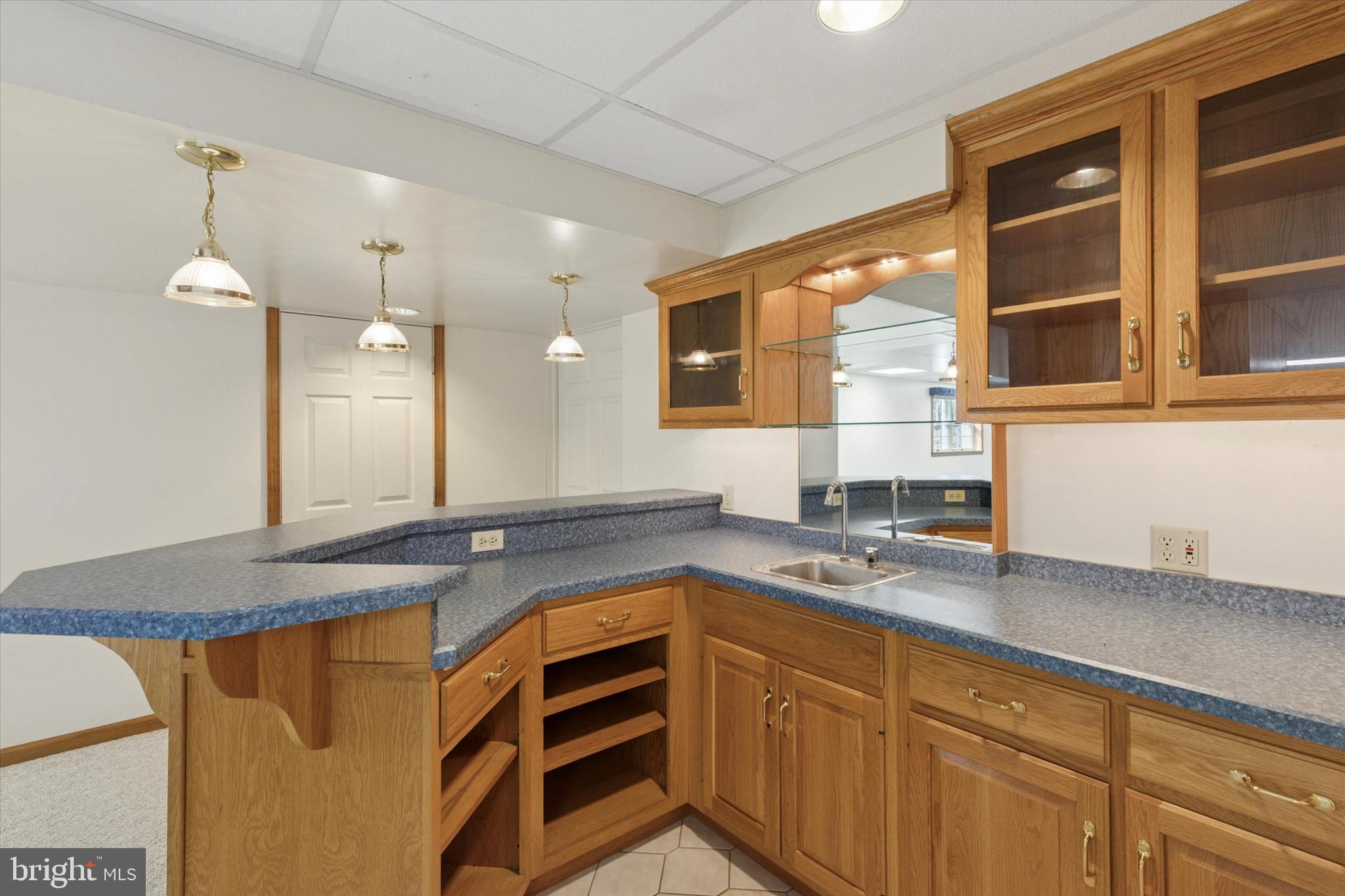 82 Starr Road Reading, PA 19608 - Photo 36 of 56 a kitchen with stainless steel appliances granite countertop a sink and cabinets with wooden floor