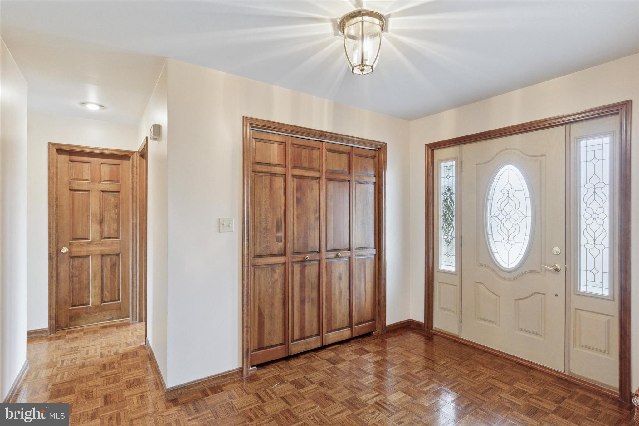 82 Starr Road Reading, PA 19608 - Photo 7 of 56 a view of a livingroom with a chandelier fan and closet area
