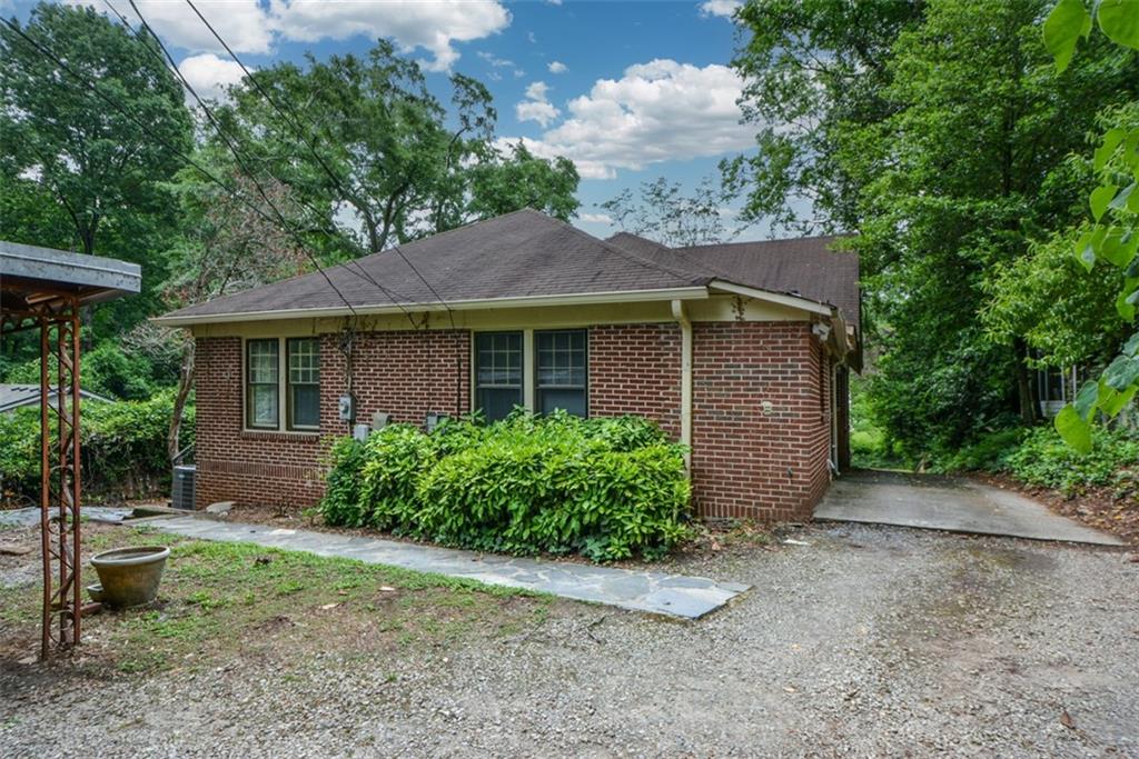 1424 Emory Road Northeast Atlanta, GA 30306 - Photo 28 of 36 a front view of house with yard and green space