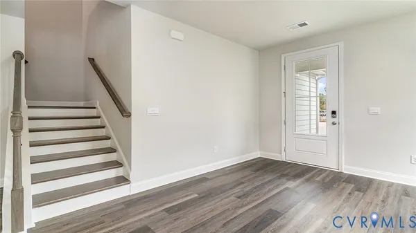 a view of entryway with wooden floor