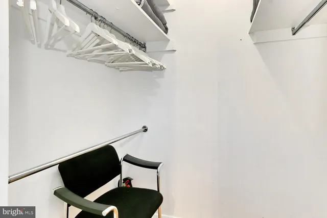 a living room with a couch and a rug