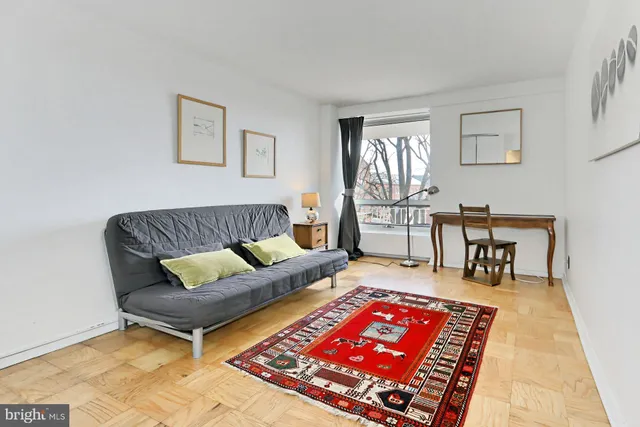a bathroom with a sink vanity mirror and toilet