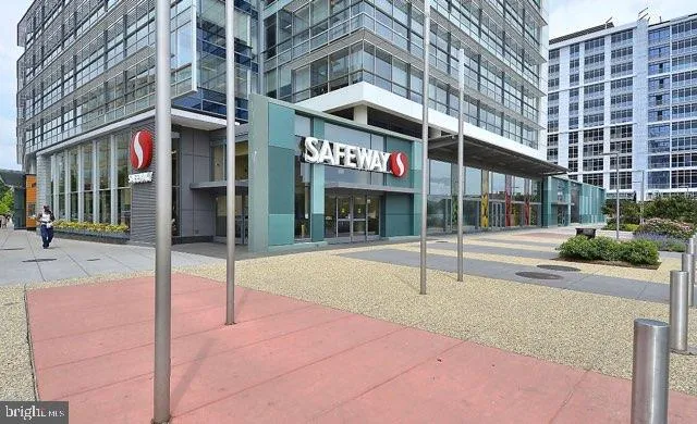 a view of roof deck with dining table and chairs