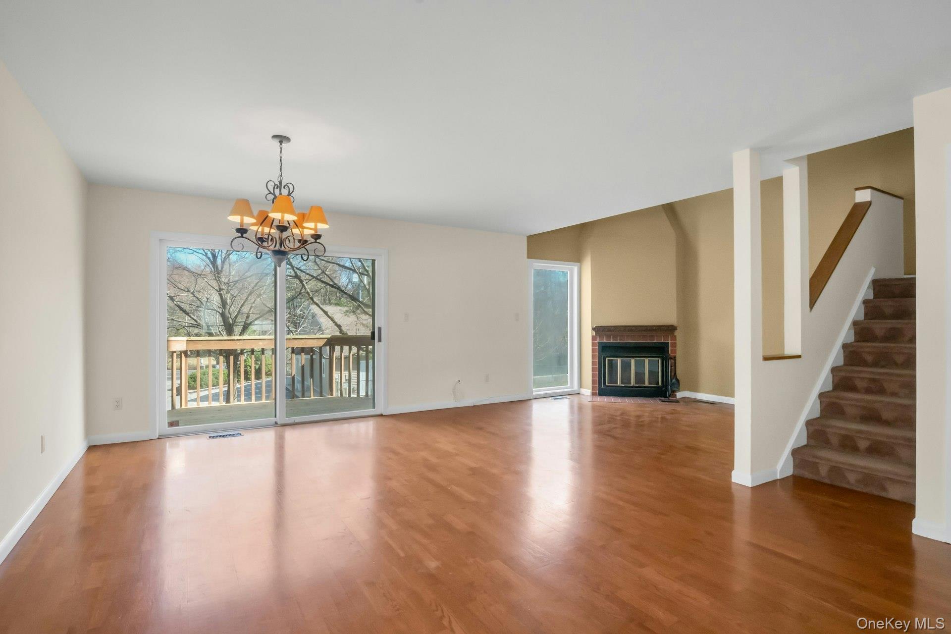1 Spring Pond Drive, Unit 1 Ossining, NY 10562 - Photo 11 of 34 a view of an empty room with wooden floor and a window